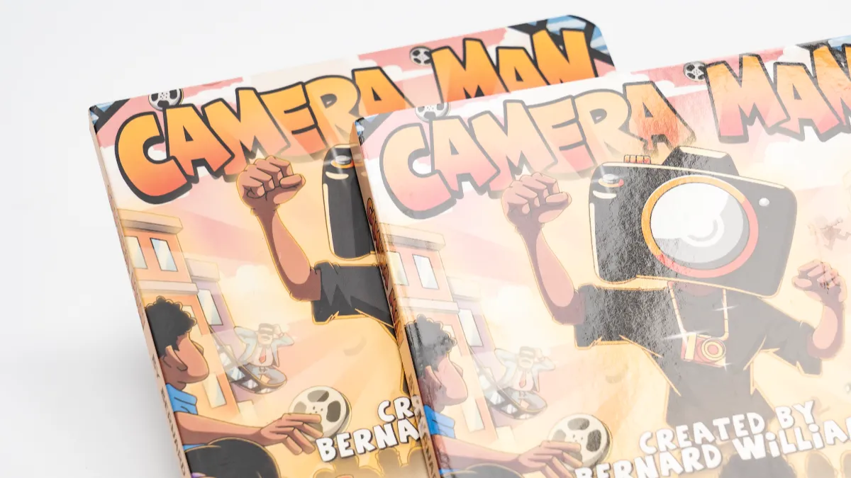 Two printed covers side by side comparing a matte surface against a glossy reflective surface