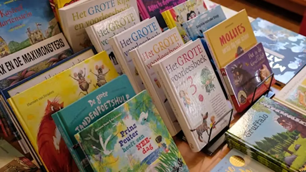 a pile of children's board books sitting on top of a table